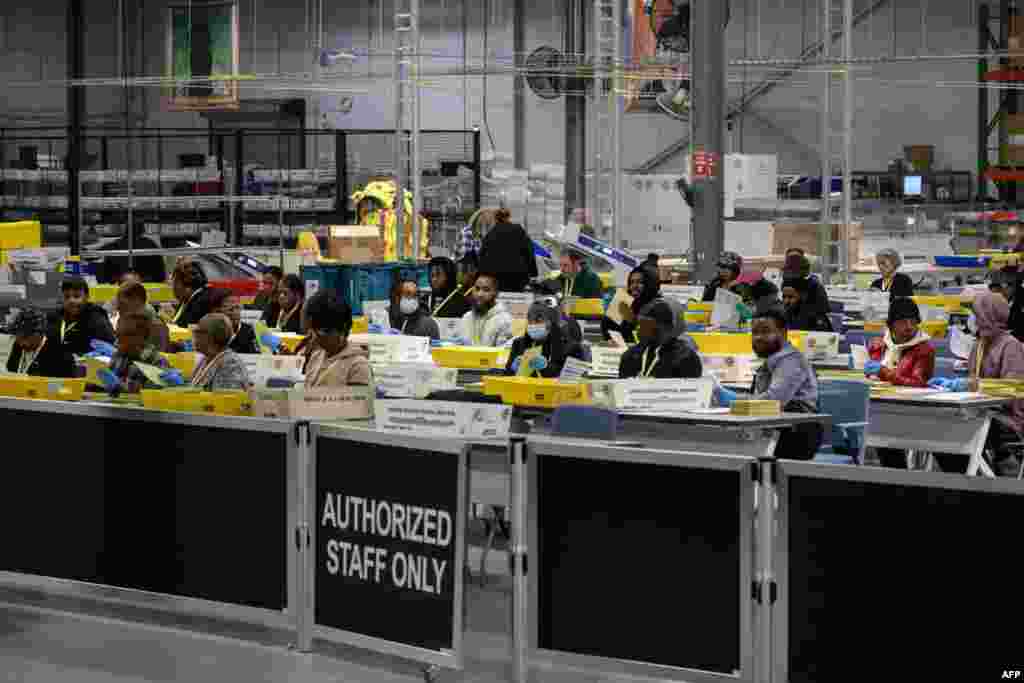 Philadelphia County board of elections staff process mail-in ballots at the ballot counting election warehouse on Election Day, on the outskirts of Philadelphia, Pennsylvania, Nov. 5, 2024. 