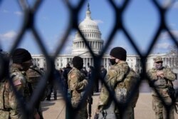 National Guard keep watch on Capitol Hill in Washington, D.C.&nbsp;Capitol Police say they have uncovered intelligence of a "possible plot" by a militia group to breach the Capitol.