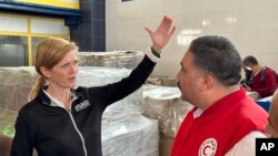 Samantha Power, Administrator of the United States Agency for International Development (USAID), speaks to an Egyptian Red Crecent official as she arrives at the international humanitarian assistance hub in Al-Arish, Egypt, Tuesday, Dec. 5, 2023. 