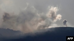 A picture taken from northern Israel, along the border with southern Lebanon on Sept. 22, 2024, shows smoke billowing following Israeli bombardment on the Lebanese village of Markaba. 