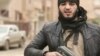 A YouTube screen grab of an IS Russian-language propaganda video shows an armed militant calling on would-be jihadists to join the group. According to the Russian government, more than 4,000 Russian citizens have traveled to Iraq and Syria to fight in various jihadist groups.