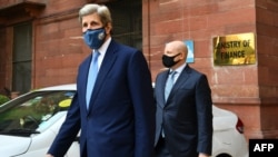 US climate envoy John Kerry (left) leaves the Ministry of Finance after a meeting with Indian Finance Minister Nirmala Sitharaman in New Delhi on April 6, 2021.