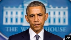 President Barack Obama listens to a question as he spoke about the situation in Ukraine in the Brady Press Briefing Room of the White House, July 18, 2014. 