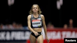 Russian whistleblower and runner Yulia Stepanova, who helped expose massive doping problems in Russia that led to the country's track and field team being banned from international competition, takes the track to compete as a neutral athlete in the 800 meter race at the Boston Indoor Grand Prix in Boston, Jan, 28, 2017. 