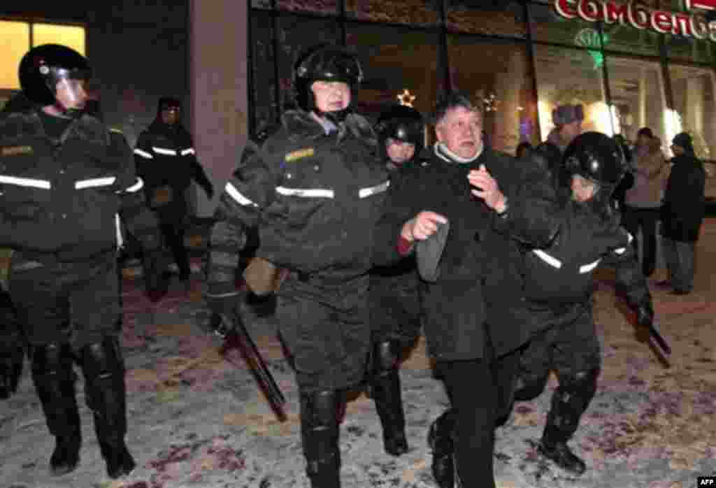 Riot police officers detain a protester during a rally in Minsk, Berlarus, Monday, Dec. 20, 2010. Thousands of opposition supporters in Belarus tried to storm the main government building to protest what the opposition claims was large-scale vote-rigging 