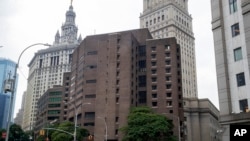 FILE - The Metropolitan Correctional Center in New York, where Jeffrey Epstein was being held the night he killed himself, is seen Aug. 13, 2019.