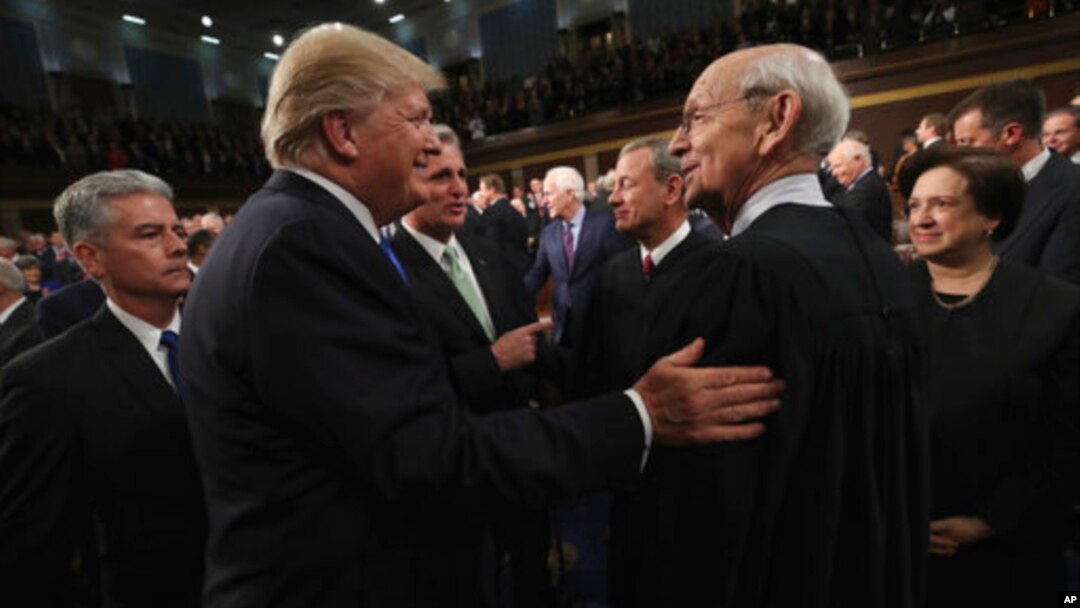 FILE - President Donald Trump greets Supreme Court Associate Justice Stephen Breyer before the State of the Union address in the chamber of the U.S. House of Representatives Tuesday, Jan. 30, 2018, in Washington. 