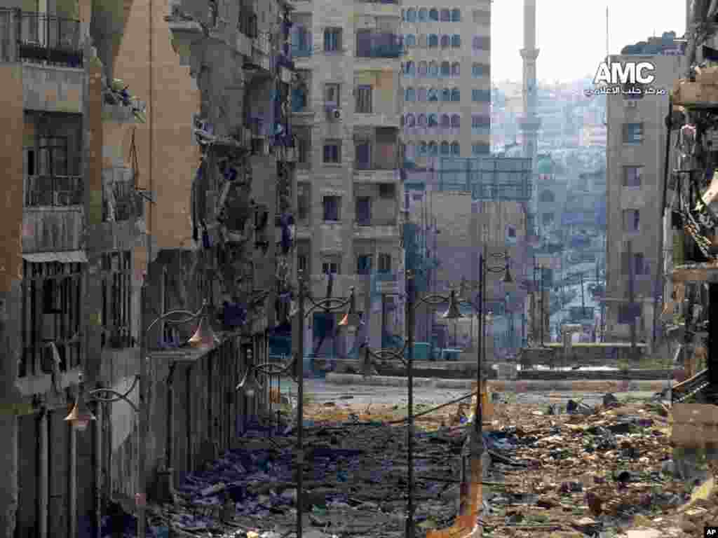 This citizen journalism image provided by Aleppo Media Center AMC shows damages from fighting between government forces and Free Syrian army fighters in Aleppo, Syria, Sept. 4, 2013.