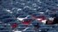 Newly manufactured Tesla electric cars are pictured in a storage area at The Western Docks in Southampton on April 20, 2020.