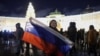 People take part in New Year celebrations in Palace Square in St. Petersburg, Russia, Jan. 1, 2025. 