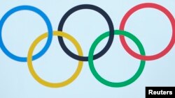 FILE - International Olympic Committee (IOC) logo is seen during an extraordinary session in Lausanne, Switzerland, July 11, 2017. 