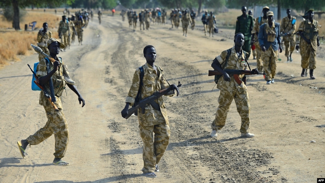 Sudan People's Liberation Army (SPLA) soldiers patrol a road in Mathiang near Bor, Jan. 31, 2014. 