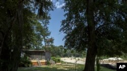 FILE—Josephine Wright's back porch is the center of a law suit that claims it is encroaching on a developer's project, July 18, 2023, in Hilton Head Island, South Carolina.