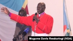 A Catholic priest leads the congregation in prayer in Juba in July 2012. 