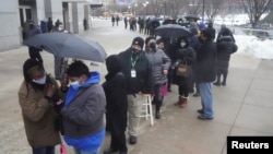 People line up outside Yankee stadium for vaccines amid the coronavirus disease (COVID-19) pandemic in the Bronx borough of New York City, New York, Feb. 5, 2021.