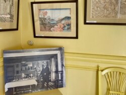A photo of Claude Monet in his kitchen. (Photo: Lisa Bryant/VOA)