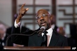 FILE - U.S. Sen. Raphael Warnock, D-Ga., also a senior pastor at Ebenezer Baptist Church, January 15, 2023, in Atlanta.