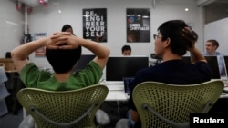 Students attend Code Chrysalis, a software-coding boot camp, at a basement room in Tokyo, Japan, May 23 2018. (REUTERS/Toru Hanai)