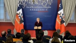 Chile's President Michelle Bachelet delivers a message asking for forgiveness from indigenous Mapuche people for "errors and horrors" committed by the state and announcing plans to give them more power and resources, at the government house in Santiago, Junr 23, 2017.