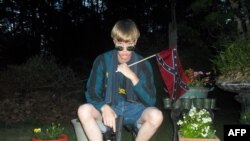 This undated photo taken from Lastrhodesian.com allegedly shows Dylann Roof. The website, which surfaced after the murder of nine parishoners at an African American Church in Charleston, South Carolina, also included a white supremacist manifesto.