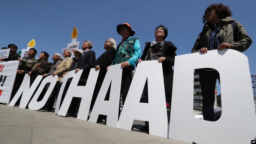 FILE - Protesters hold letters reading "NO THAAD" during a rally to oppose the U.S. missile defense system called Terminal High-Altitude Area Defense, or THAAD, April 26, 2017. 