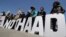FILE - Protesters hold letters reading "NO THAAD" during a rally to oppose the U.S. missile defense system called Terminal High-Altitude Area Defense, or THAAD, April 26, 2017. 