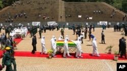 Pallbearers carry the coffin of a government minister, Dr. Ellen Gwaradzimba, who died of COVID-19, at the Heroes Acre in Harare, Jan. 21, 2021. As of Jan. 23, Zimbabwe had lost four Cabinet ministers and several senior officials to the virus.