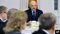 Belarusian President Alexander Lukashenko speaks during a meeting with the working group on finalizing the draft of the new Constitution of Belarus in Minsk, Nov. 15, 2021. 