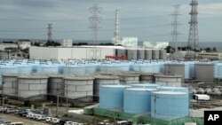 This Oct. 12, 2017, photo, shows tanks holding contaminated, treated but still slightly radioactive, water at the wrecked Fukushima Dai-ichi nuclear plant in Okuma, Fukushima Prefecture, northeast of Tokyo. (Pablo M. Diez/Pool Photo via AP)