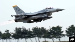 FILE - U.S. Air Force's F-16 fighter takes off during an exercise at Kunsan Air Base in Gunsan, South Korea on April 20, 2017. A U.S. Air Force pilot safely ejected on Dec. 11, 2023, before his F-16 crashed into the sea off South Korea’s southwestern coast. 