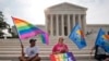 FILE - Same-sex marriage supporters gather outside of the Supreme Court in Washington, June 26, 2015. 