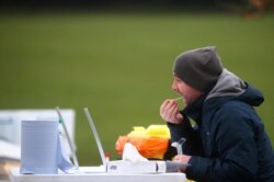 A man takes a swab at a test center in Goldsworth Park, as the South African variant of the novel coronavirus is reported in parts of Surrey, in Woking, Britain, Feb. 1, 2021.