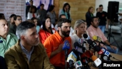 Juan Andres Mejia (C), lawmaker of the opposition party Popular Will (Voluntad Popular), talks to the media during a news conference in Caracas, Venezuela, Jan. 26, 2018.