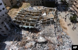 An aerial view of the destroyed building housing the offices of The Associated Press and other media, after it was hit last week by Israeli airstrikes, in Gaza City, May 22, 2021.