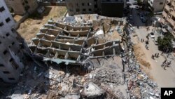 An aerial view of the destroyed building housing the offices of The Associated Press and other media, after it was hit by Israeli airstrikes, in Gaza City, May 22, 2021.