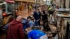 People clean their houses affected by floods in Utiel, Spain, Oct. 30, 2024. 