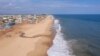 This aerial view shows the coastline of a beach east of Cotonou on October 23, 2023.