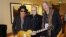 Image distributed by Gibson Brands shows Musician Joe Perry (L), Dave Berryman, President of Gibson Guitar (C), and Peter Leinheiser, Senior Director of GIbson Entertainment Relations, posing together after Perry was presented a Gibson Custom Made 2 Measure Aged Goldtop Les Paul guitar at NAMM 2017, Jan. 21, 2017, in Anaheim, Calif. 