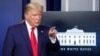 FILE - President Donald Trump points to a reporter for a question as he speaks in the James Brady Press Briefing Room of the White House, in Washington, March 31, 2020. 