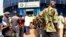 People wait in line at the BSIC bank in, Bangui, December 31, 2012.