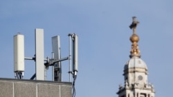 FILE - Mobile network phone masts are visible in front of St Paul's Cathedral in London, Jan. 28, 2020. Britain is among countries that, because of security concerns, have begun removing Huawei equipment that already had been installed.