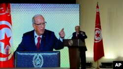 Tunisian President Beji Caid Essebsi gestures during a speech in Tunis, May 10, 2017. Tunisia's president has taken the unusual step of ordering the army to protect businesses struggling because of weeks of protests over unemployment and corruption. 