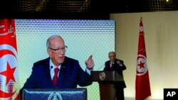 FILE - Tunisian President Beji Caid Essebsi gestures during a speech in Tunis, May 10, 2017. 