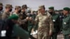 FILE - Gen. Stephen J. Townsend, head of the United States Africa Command, center, arrives to watch a large-scale drill in Morocco in June 2021.