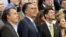 Mitt Romney, vice-presidential candidate Paul Ryan (R) and Campaign Manager Matt Rhoades pose for a staff portrait on the steps of the stage at the Republican National Convention, August 30, 2012.