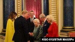 U.S. President Donald Trump and First Lady Melania Trump meet with Queen Elizabeth II, Prince Charles and Camilla, Duchess of Cornwall, during a reception at Buckingham Palace in London, Dec. 3, 2019.