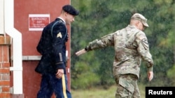 Sgt. Robert B. Bergdahl (L) leaves the court house for a lunch break during his hearing in the case of United States vs. Bergdahl in Fort Bragg, North Carolina, U.S., Oct. 16, 2017.