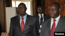 Djotodia, left, leader of the Seleka rebel alliance, beside now-exiled CAR President Francois Bozize, Libreville, Jan. 11, 2013.