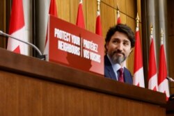FILE - Canada's Prime Minister Justin Trudeau attends a news conference in Ottawa, Ontario, Canada, Dec. 7, 2020.