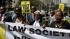 Mercy Wambua (C), CEO of the Law Society of Kenya, and other lawyers march to demand that court orders and the law are respected, following the government's deportation last week of an opposition politician in defiance of a court order that he be produced in court, in downtown Nairobi, Kenya, Feb. 15, 2018. 